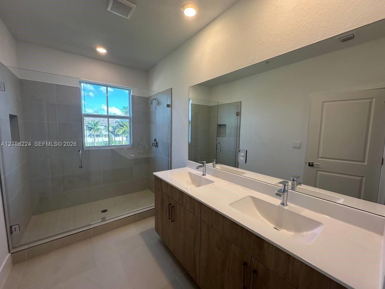 Neutral-toned carpeting, multi-panel interior doors, and recessed ceiling lighting