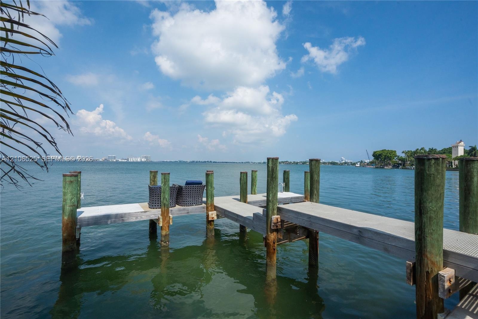 Private wooden pier featuring pilings and extended dock space extending into the water