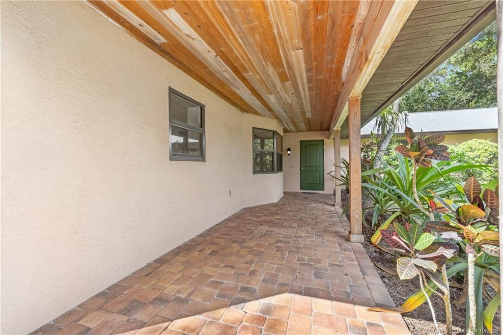 Entry porch with tongue & groove ceiling.