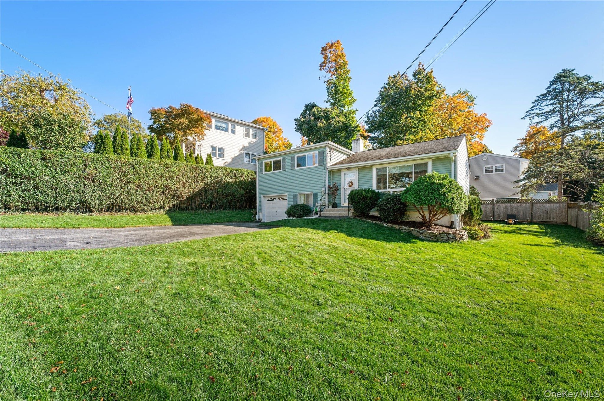 A gracious front lawn to greet the neighbors from.