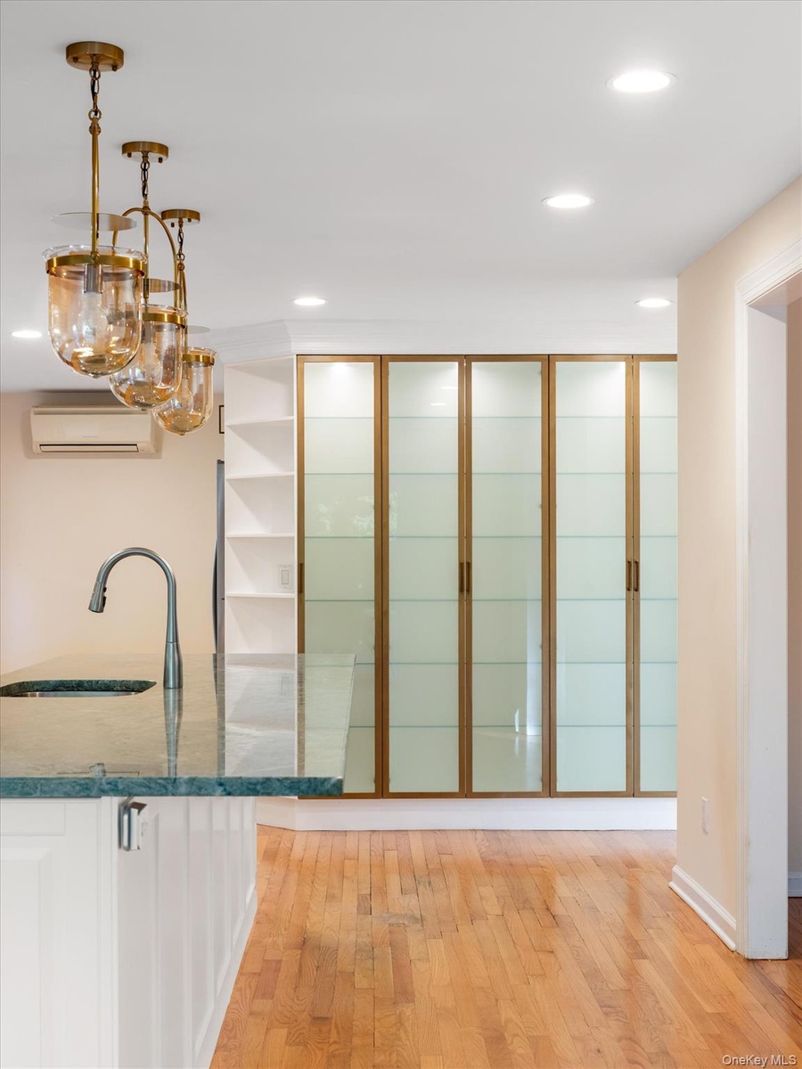 Plenty of shelving with glass doors
