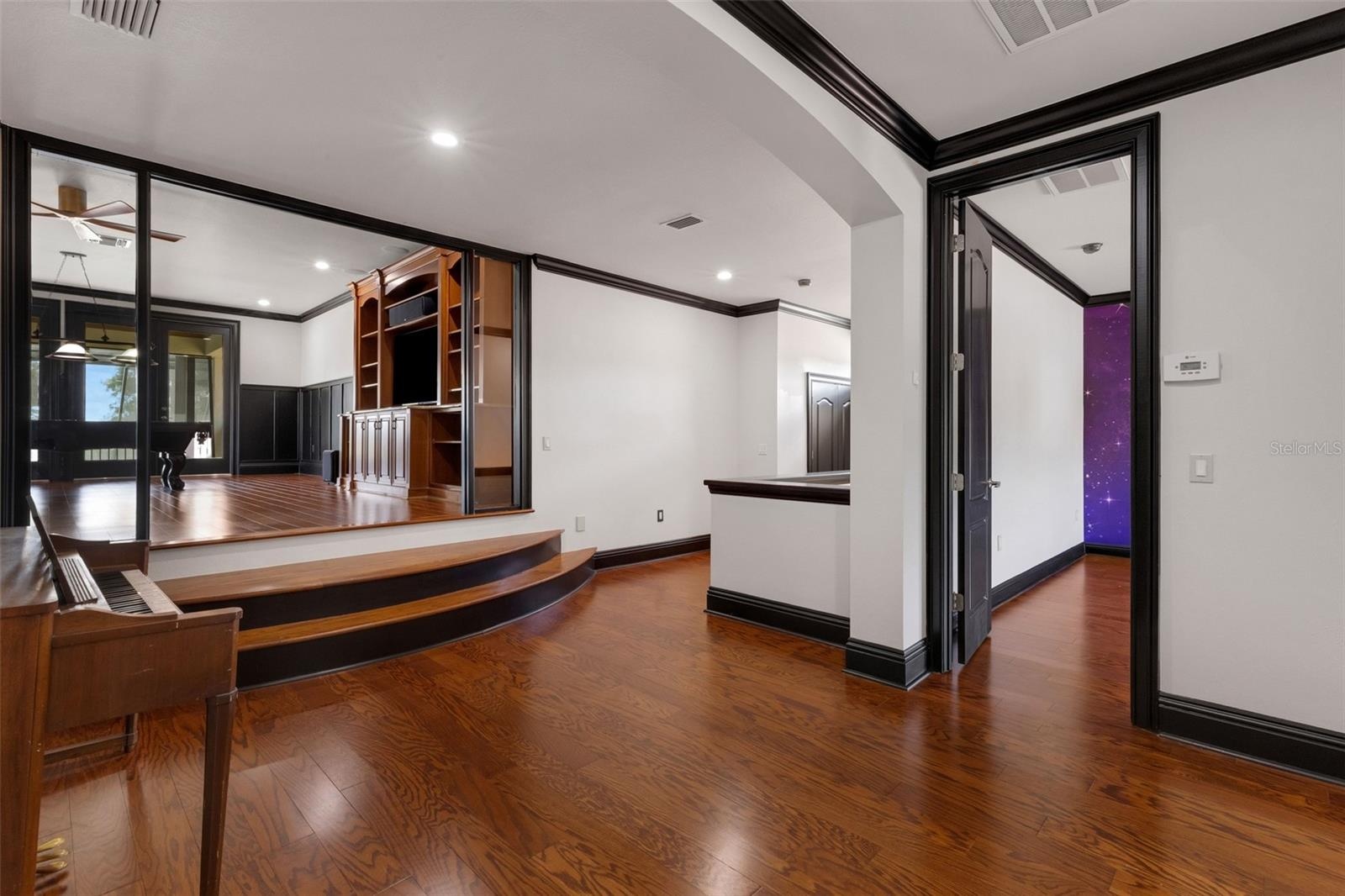 At the top of the stairway is an open common area leading to the elevated 19' x 25' game room.