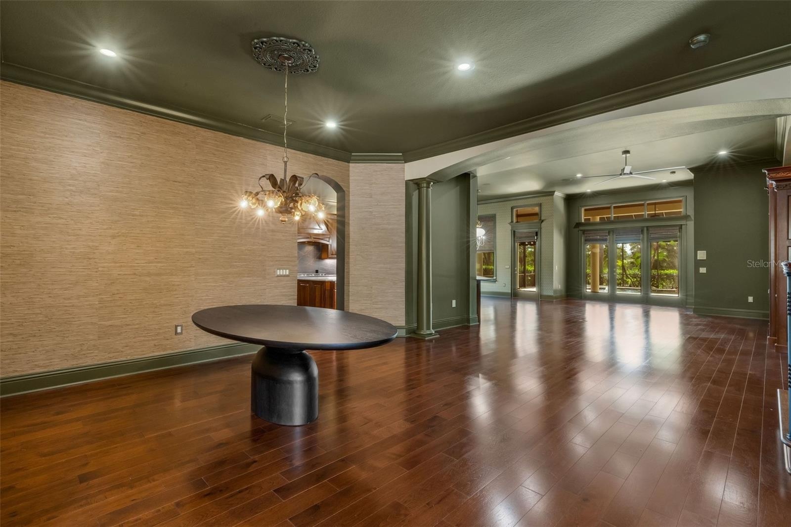 Custom grass cloth covers the wall in many of the formal spaces.