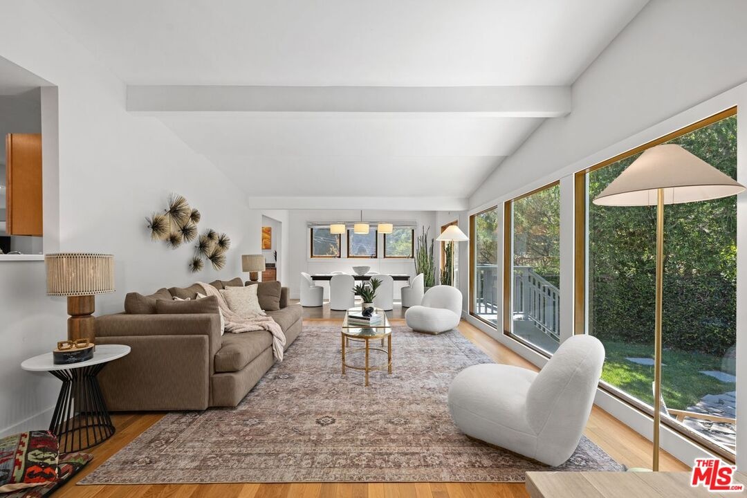 Living room opening to pool
