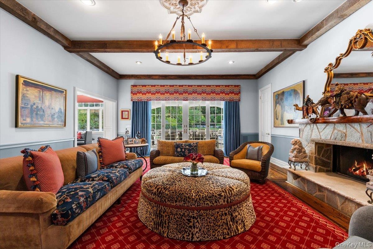 Cozy Family room adjacent to the kitchen, recreation room and outdoor entertainment area.