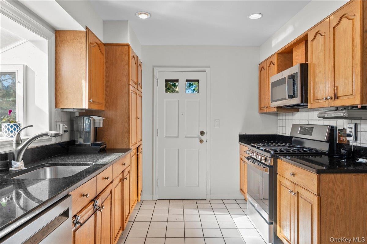 kitchen with access to patio & yard