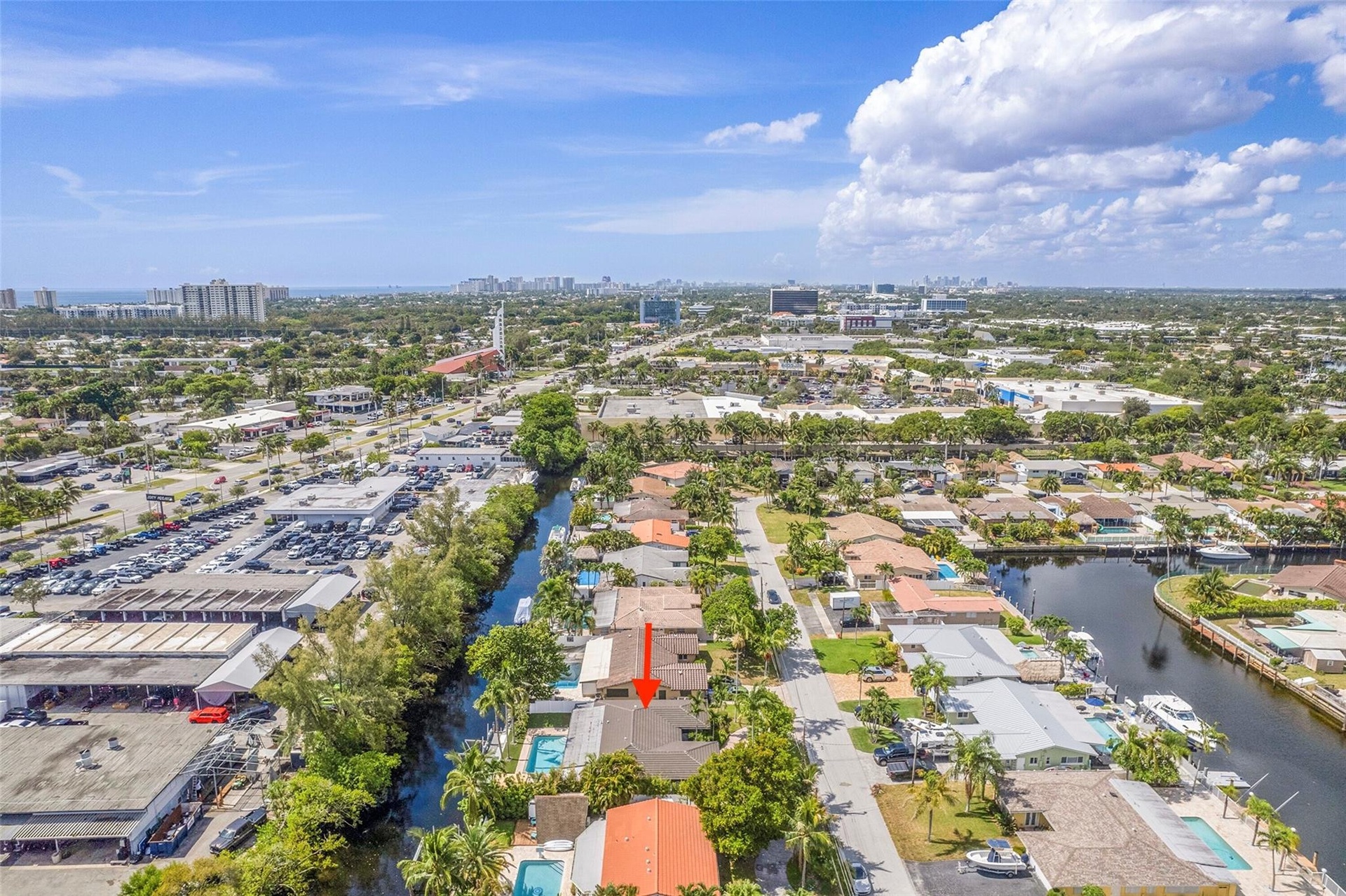 Waterfront property with private boat dock access and a swimming pool