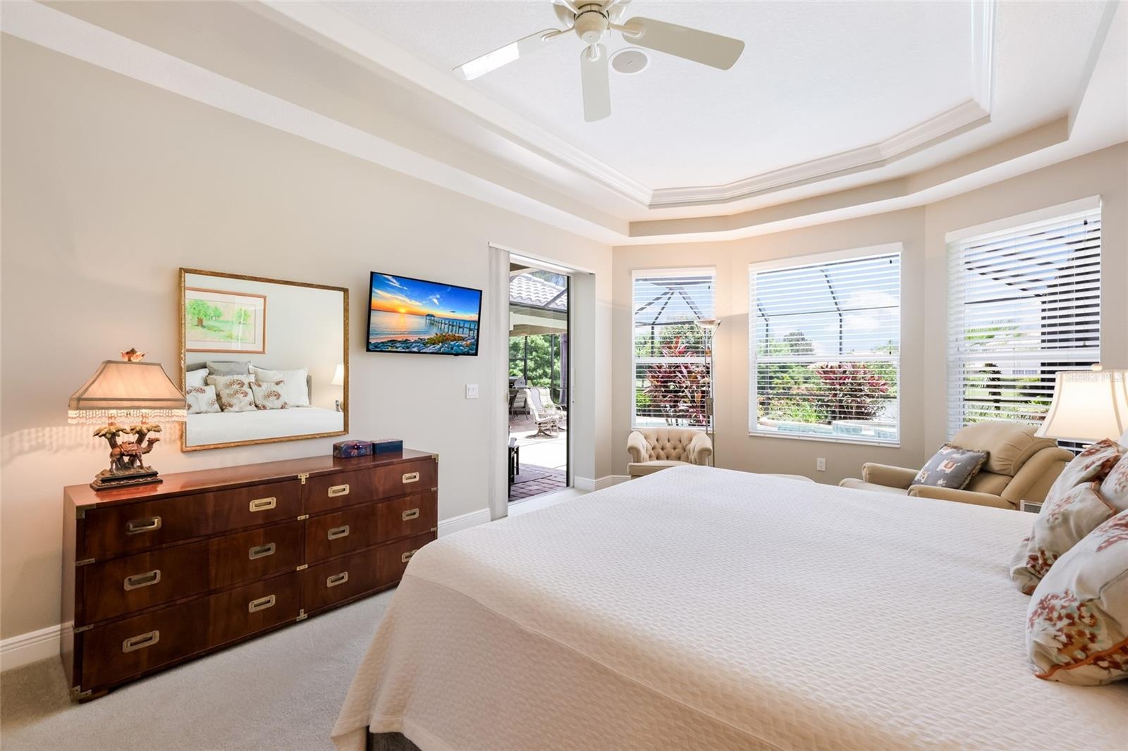 Primary suite has bay window sitting area and pocket slider to lanai