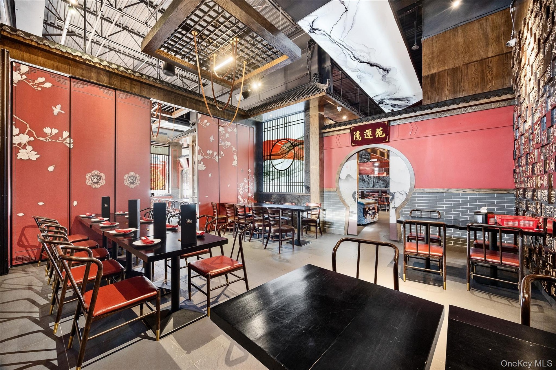 Dining space featuring a towering ceiling