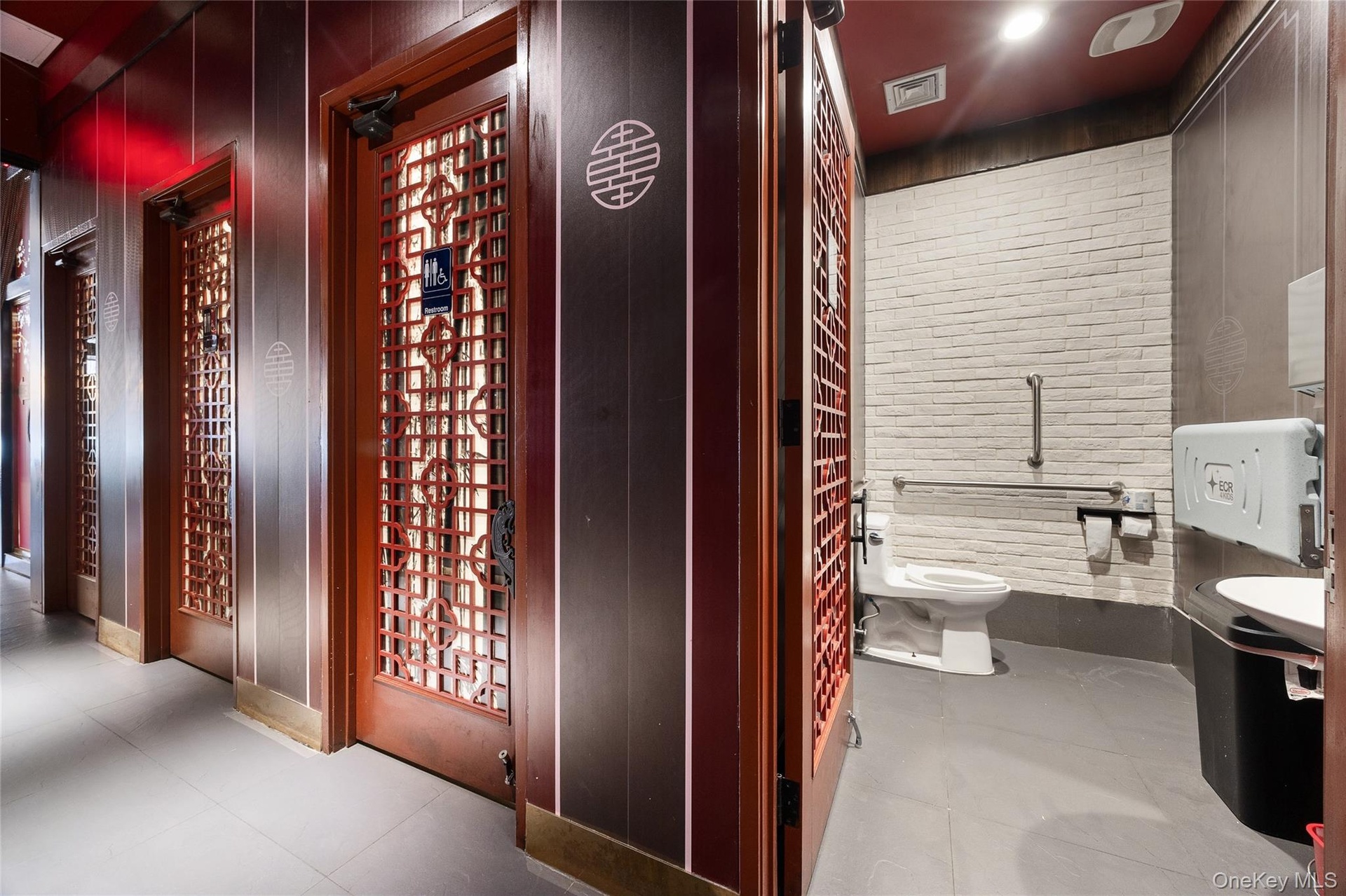 Bathroom featuring light tile patterned floors and a bidet