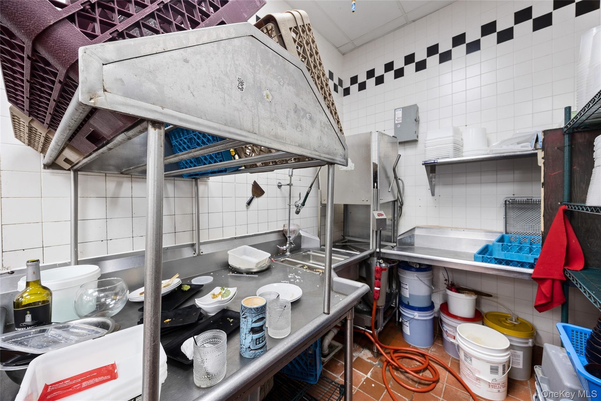 Kitchen featuring tile walls, light tile patterned flooring, decorative backsplash, and island range hood