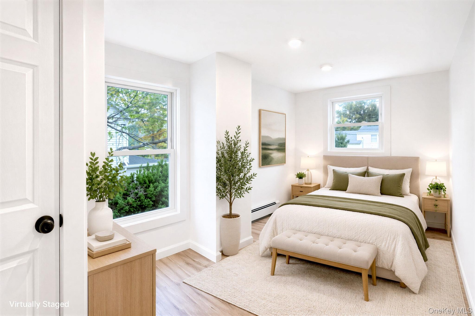 Bright interior room featuring vinyl wood-finish flooring, recessed lighting, and multiple double-hung windows