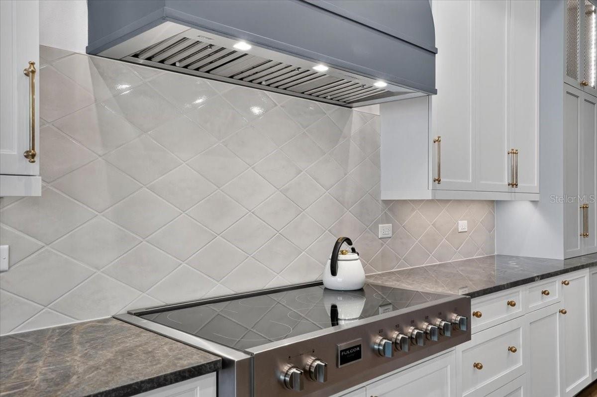 7-burner, 48" Fulgor Milano induction range and custom wood hood