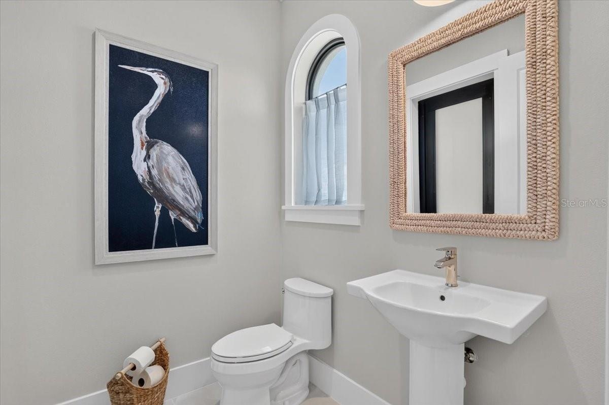 Guest/Pool Bath: Backlit mirror, Floating Vanity and Linen Closet