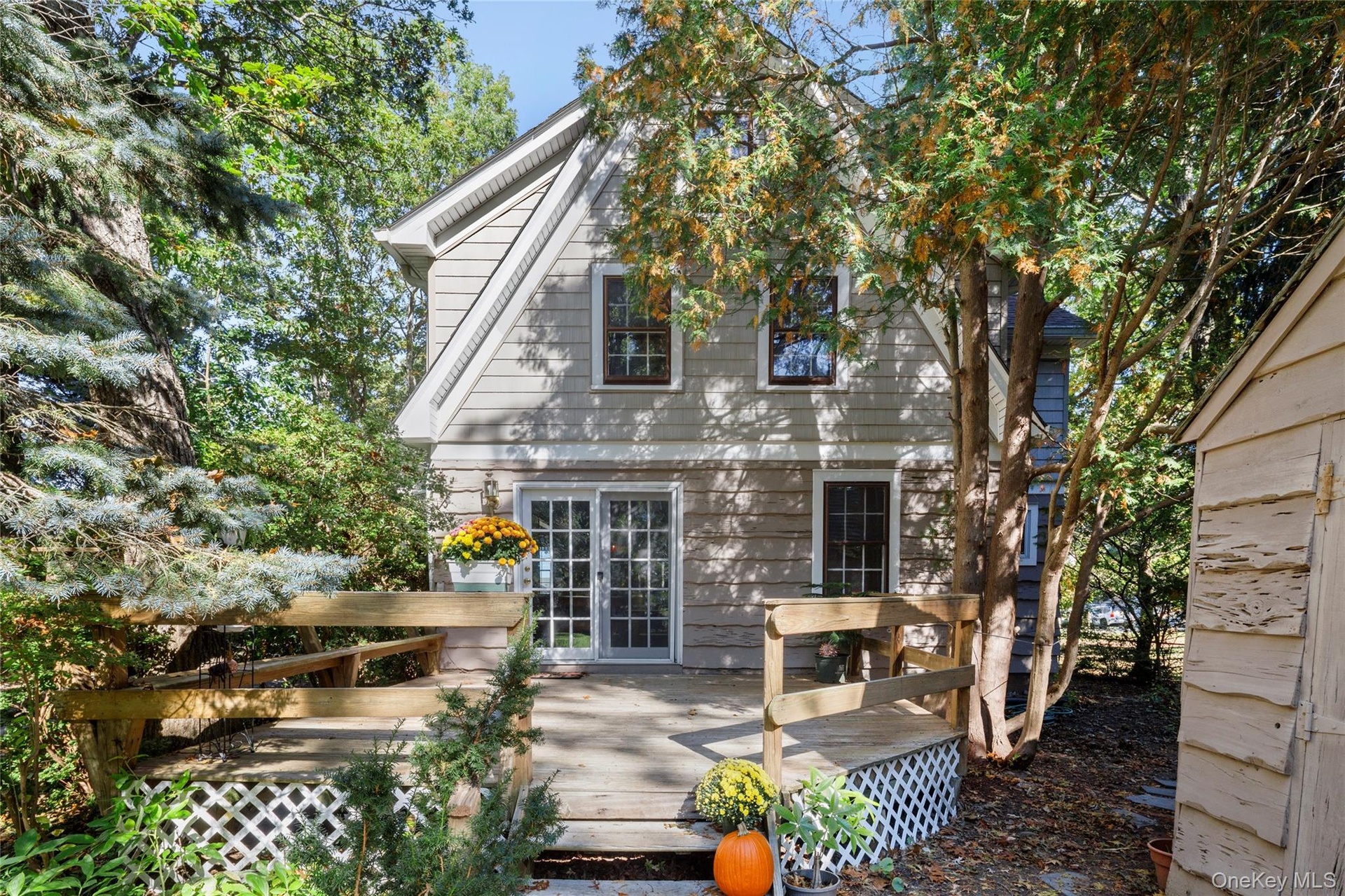 Side of the house with a back deck
