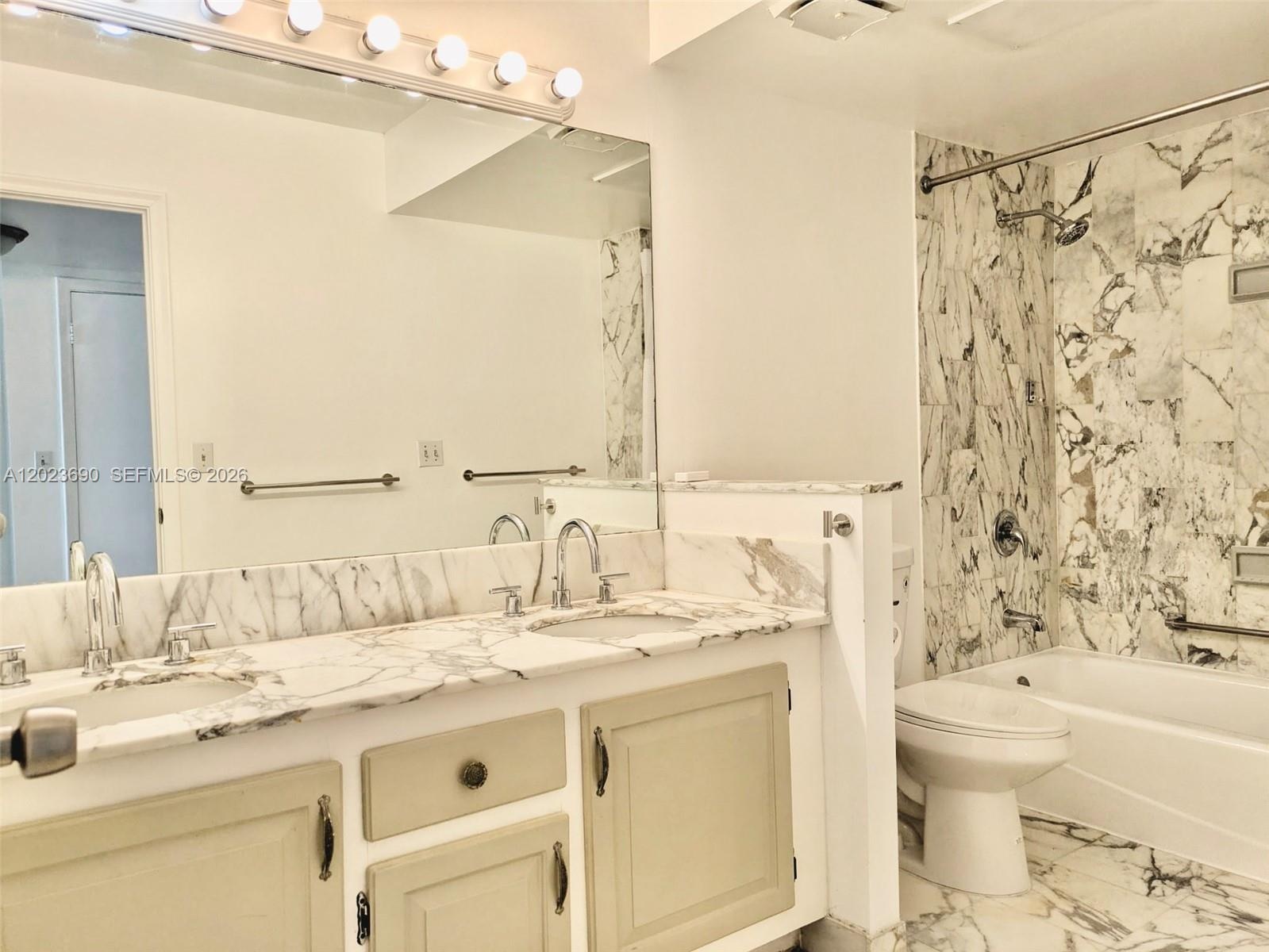Master Bathroom 2 sinks, a shower with bathtub