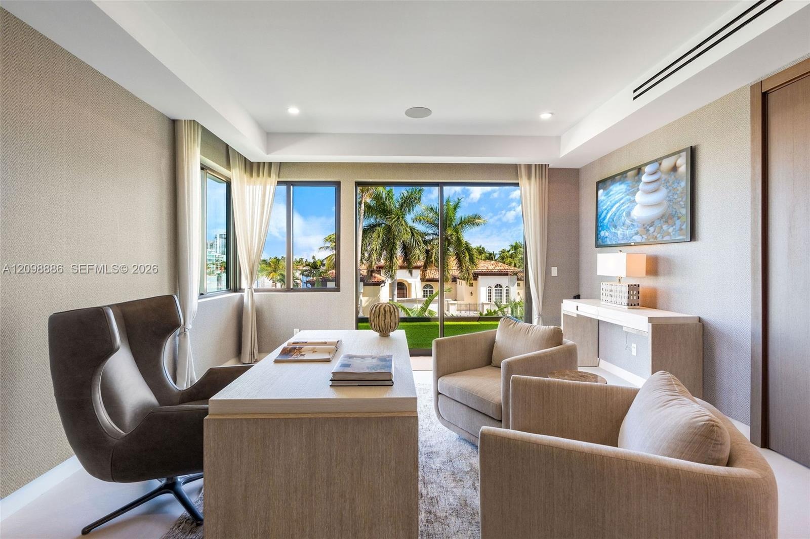 Room featuring textured wallpaper, recessed lighting, crown molding, built-in recessed wall shelving, and floor-to-ceiling glass doors with outdoor sc