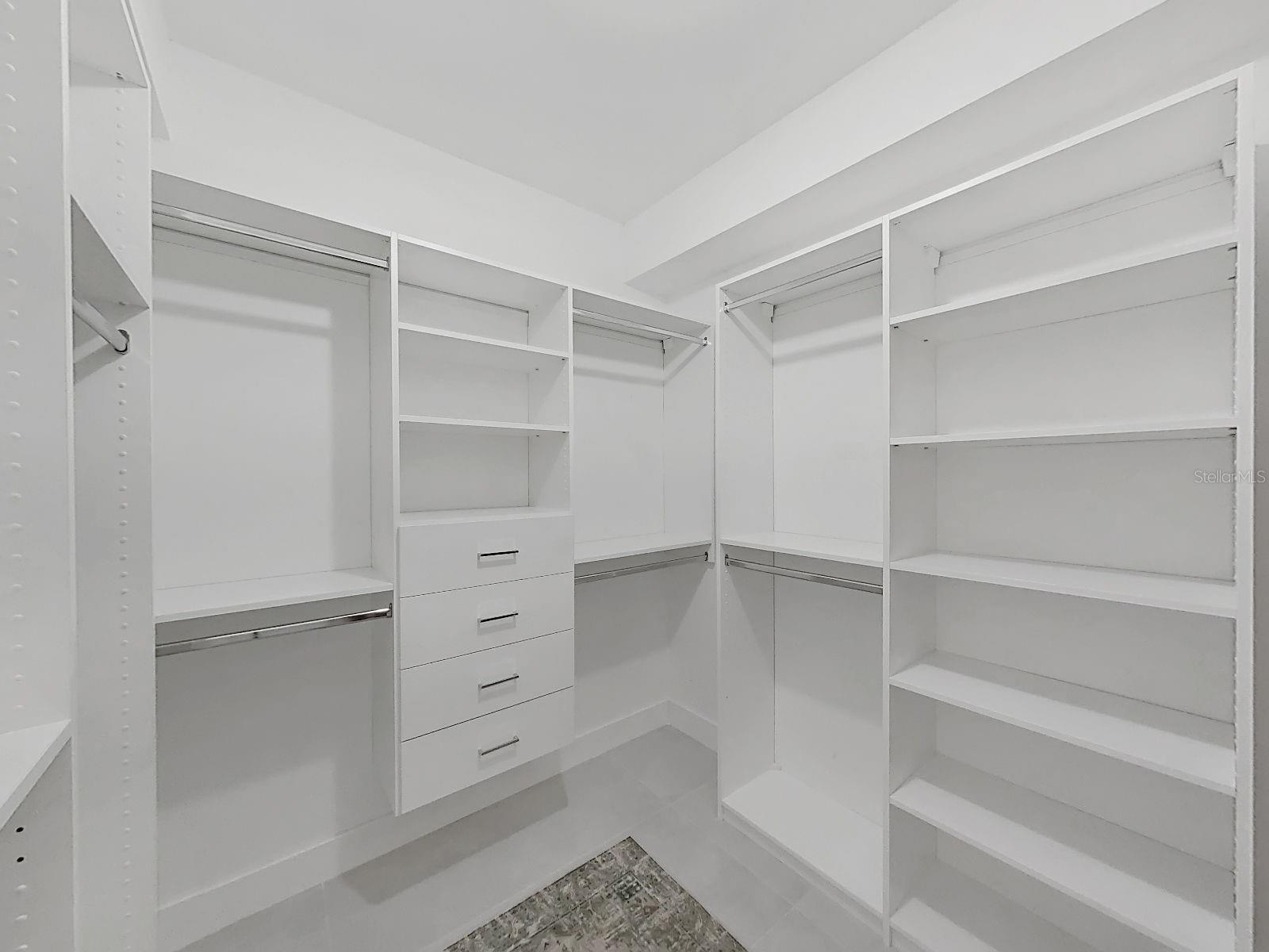 large closet with custom organizing