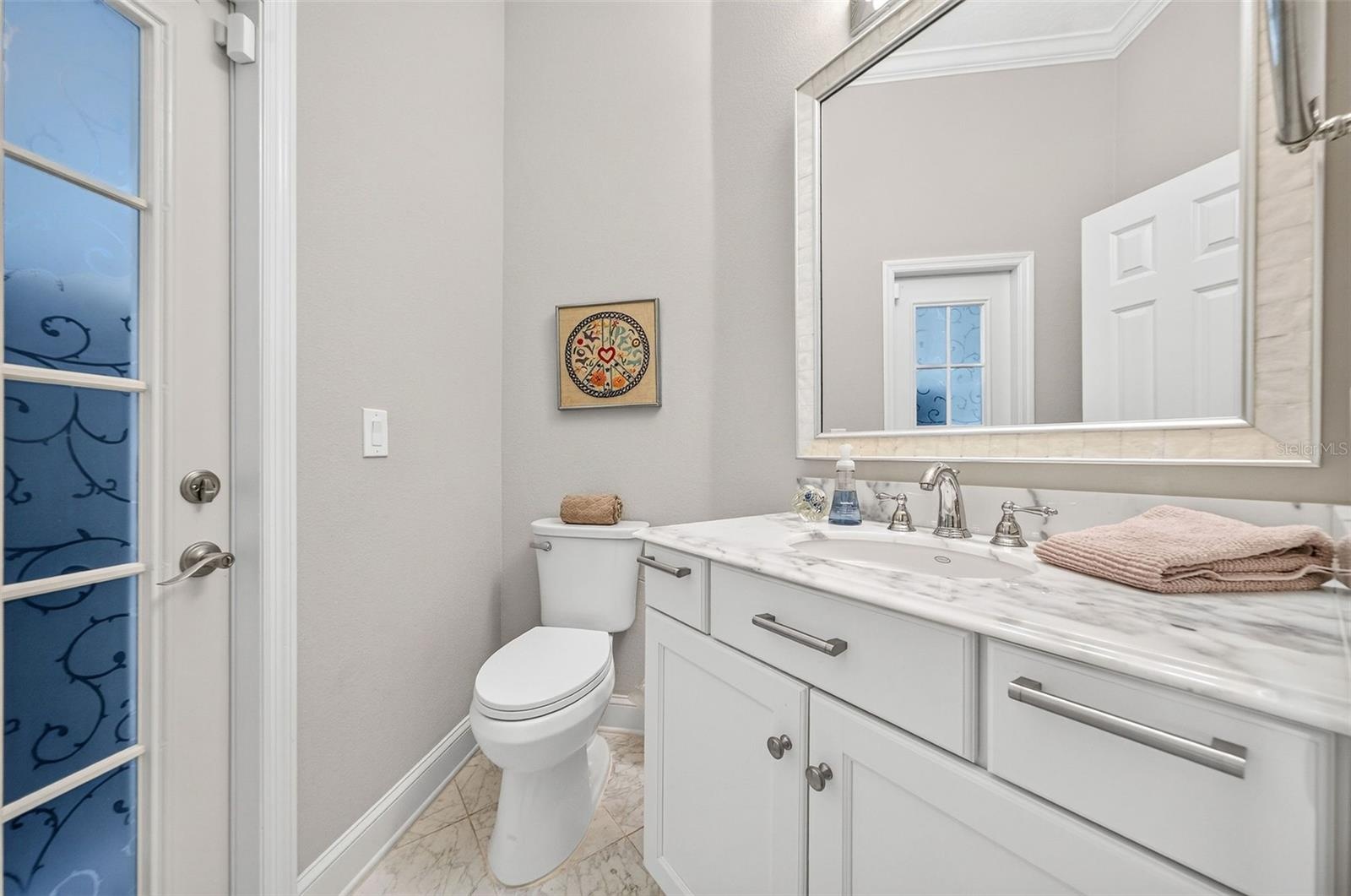 Half bath off of family room and rear porch