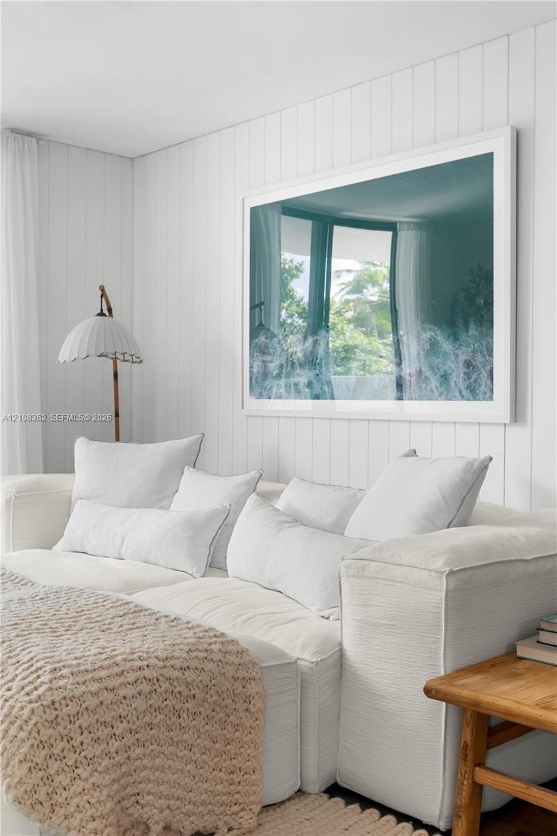 Vertical tongue-and-groove wall paneling finished in white