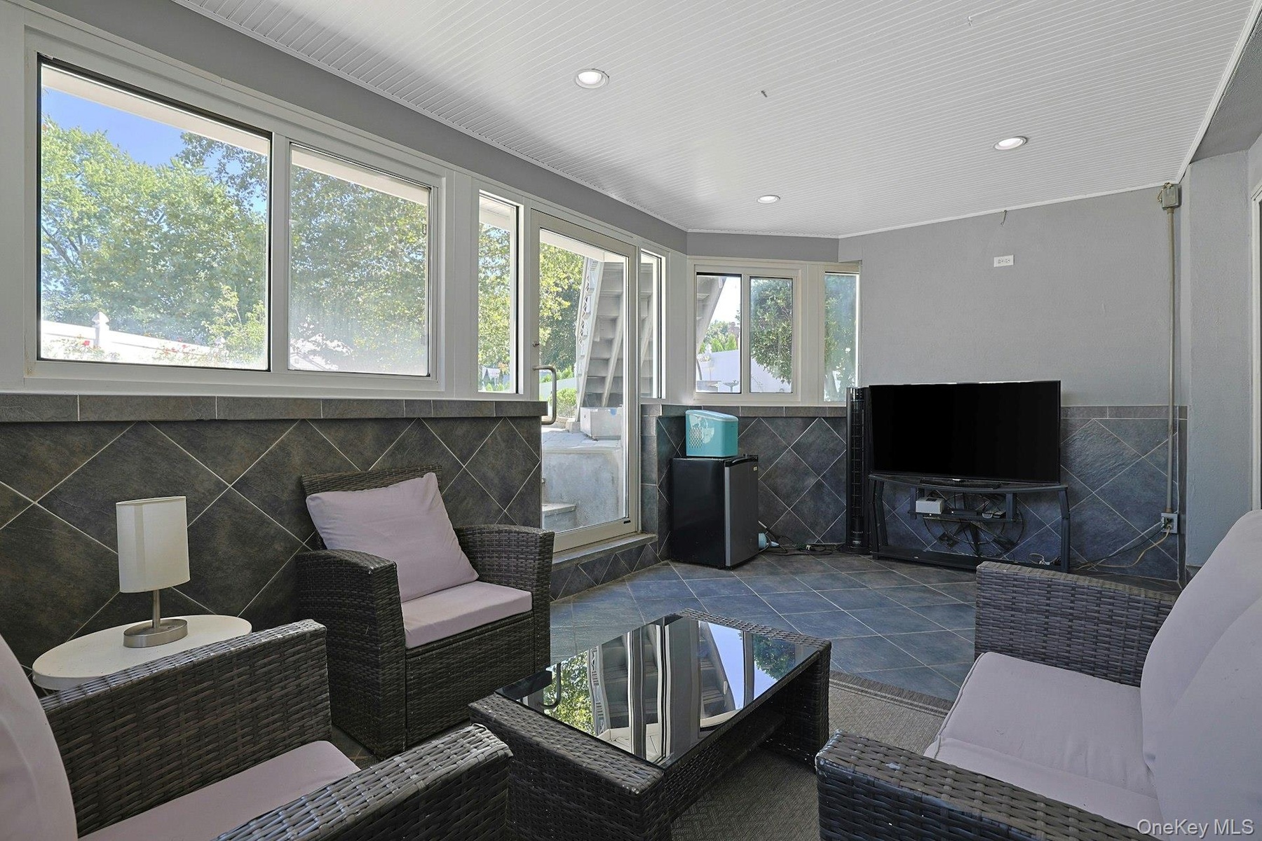 sun room with door to back property