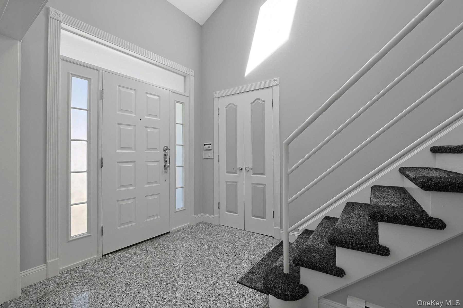 Sun-filled gracious double-height entry