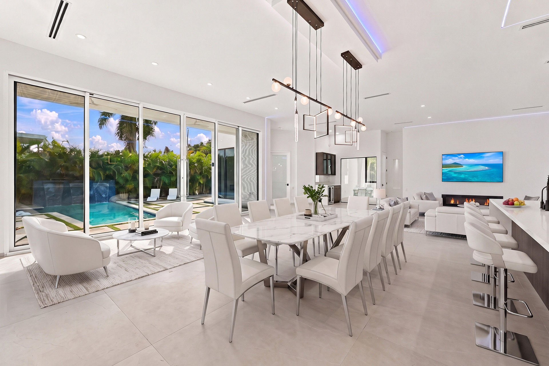 Virtually Staged. Dinning area with sitting area overlooking your heated salt water pool