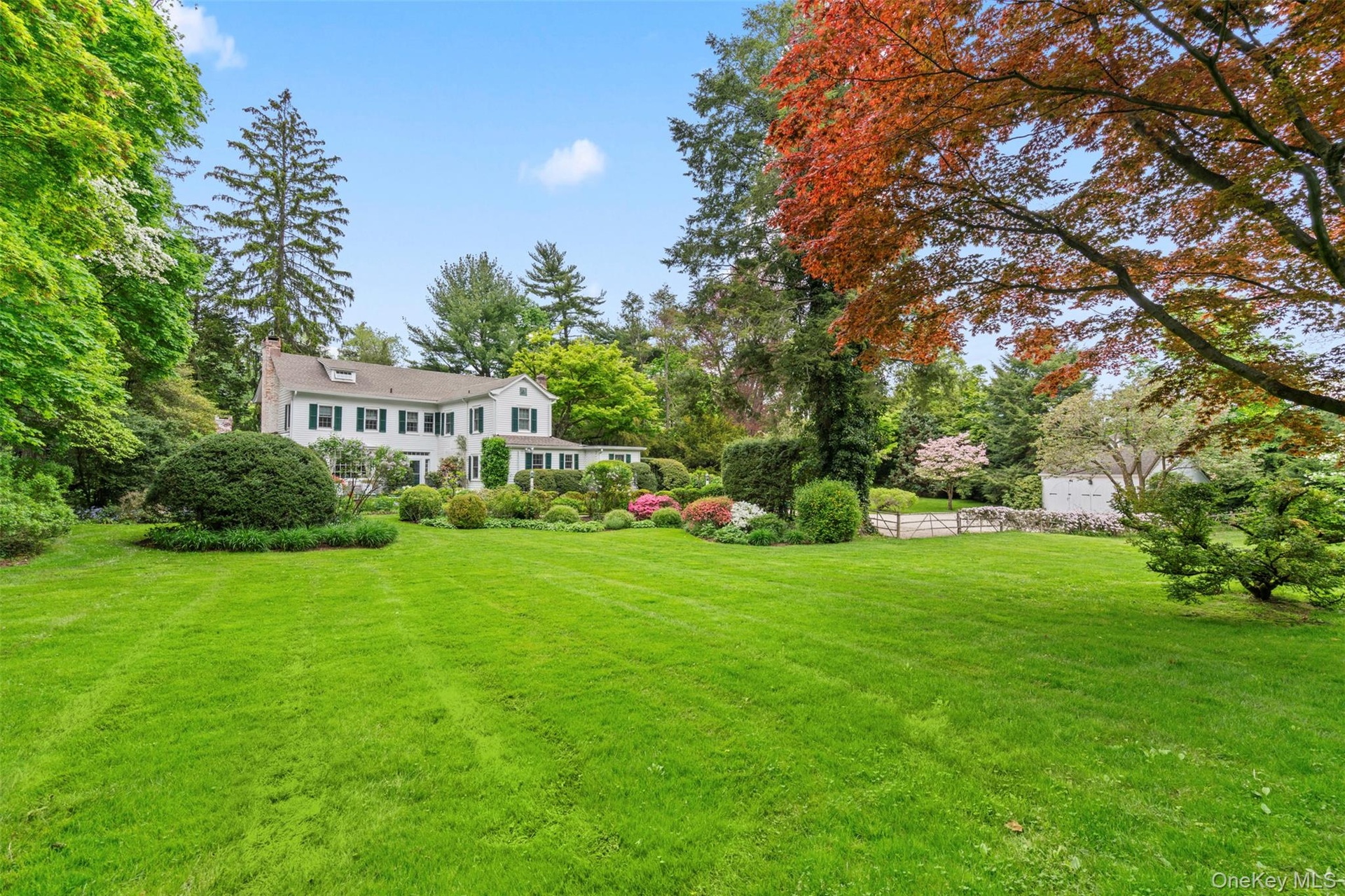Two park-like acres of lawns