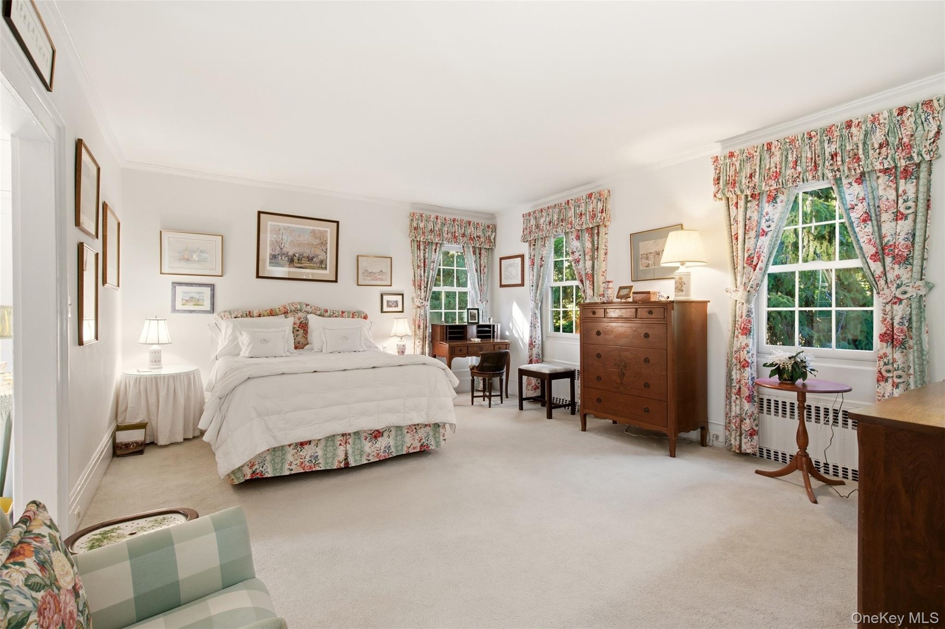 Ensuite primary bedroom with dressing room and full bath