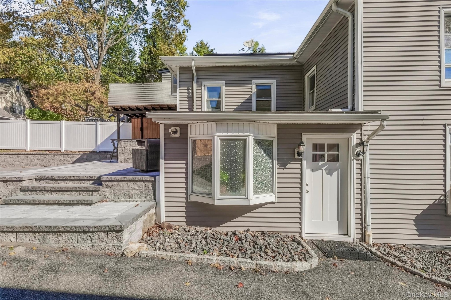 Conveniently located rear kitchen exit providing seamless, easy access to both the private backyard and the detached 2-car garage.