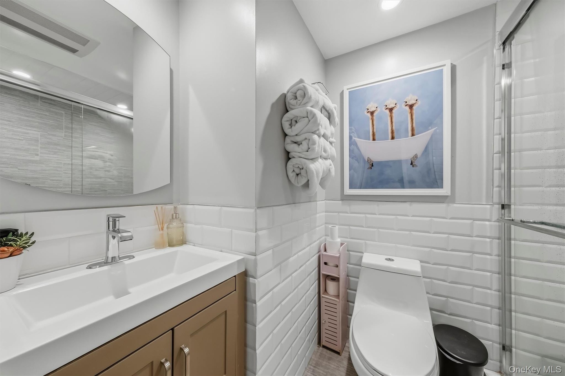 Chic, spa-like bathroom showcasing contemporary finishes, clean lines, and a bright, serene atmosphere.