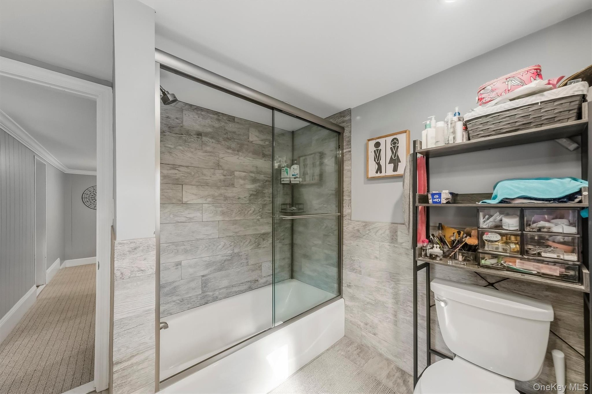 : Large, beautifully updated modern bathroom offering a spacious layout, sleek fixtures, and sophisticated styling.