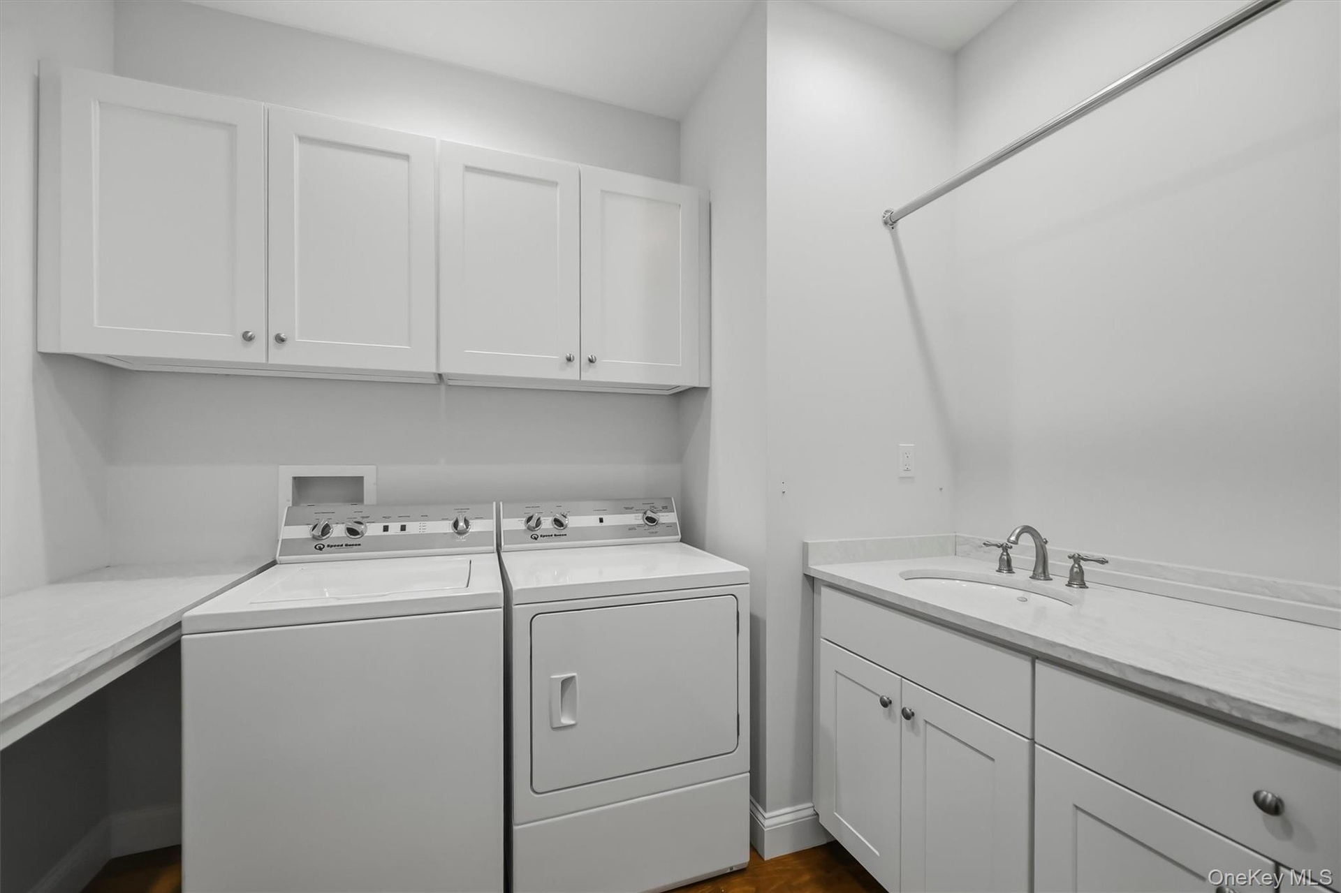 Convenient to bedrooms. Cabinets to store cleaning supplies, detergent, etc.