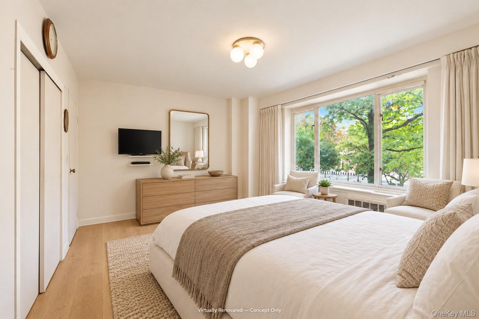 Wood-finish flooring, large multi-pane windows, and a flush-mount modern ceiling fixture