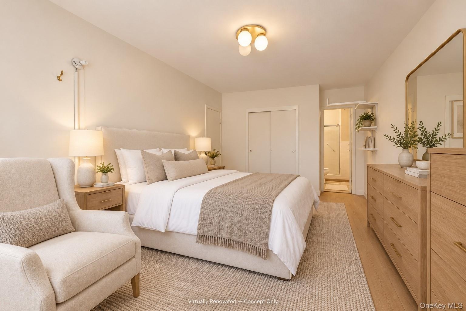 Neutral-toned interior featuring wood-finish flooring, a contemporary multi-globe ceiling light, and double-door reach-in closet