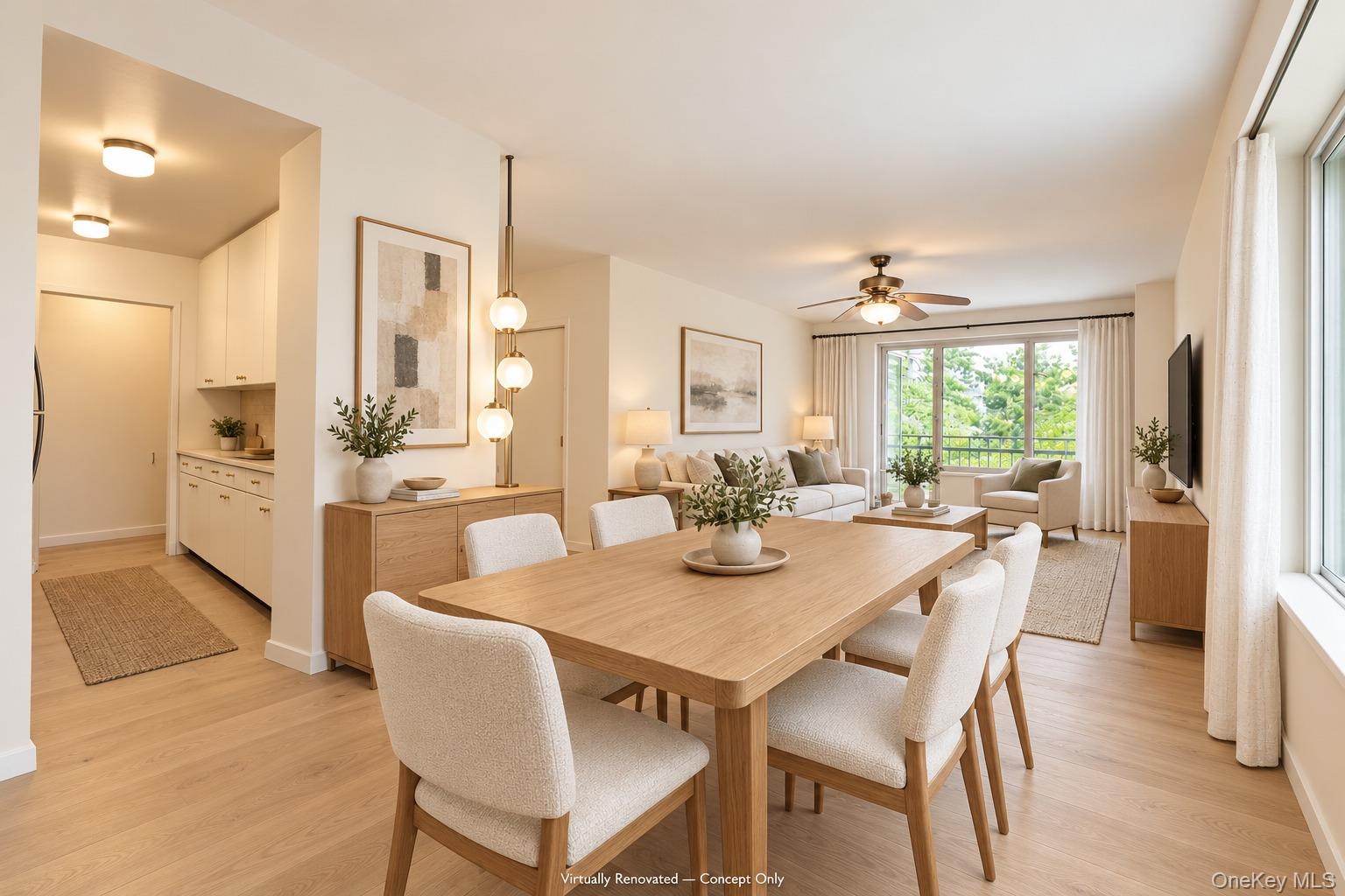 Open-concept living space featuring wood-finish flooring, recessed lighting, a modern multi-globe pendant light fixture, a ceiling fan with integrated
