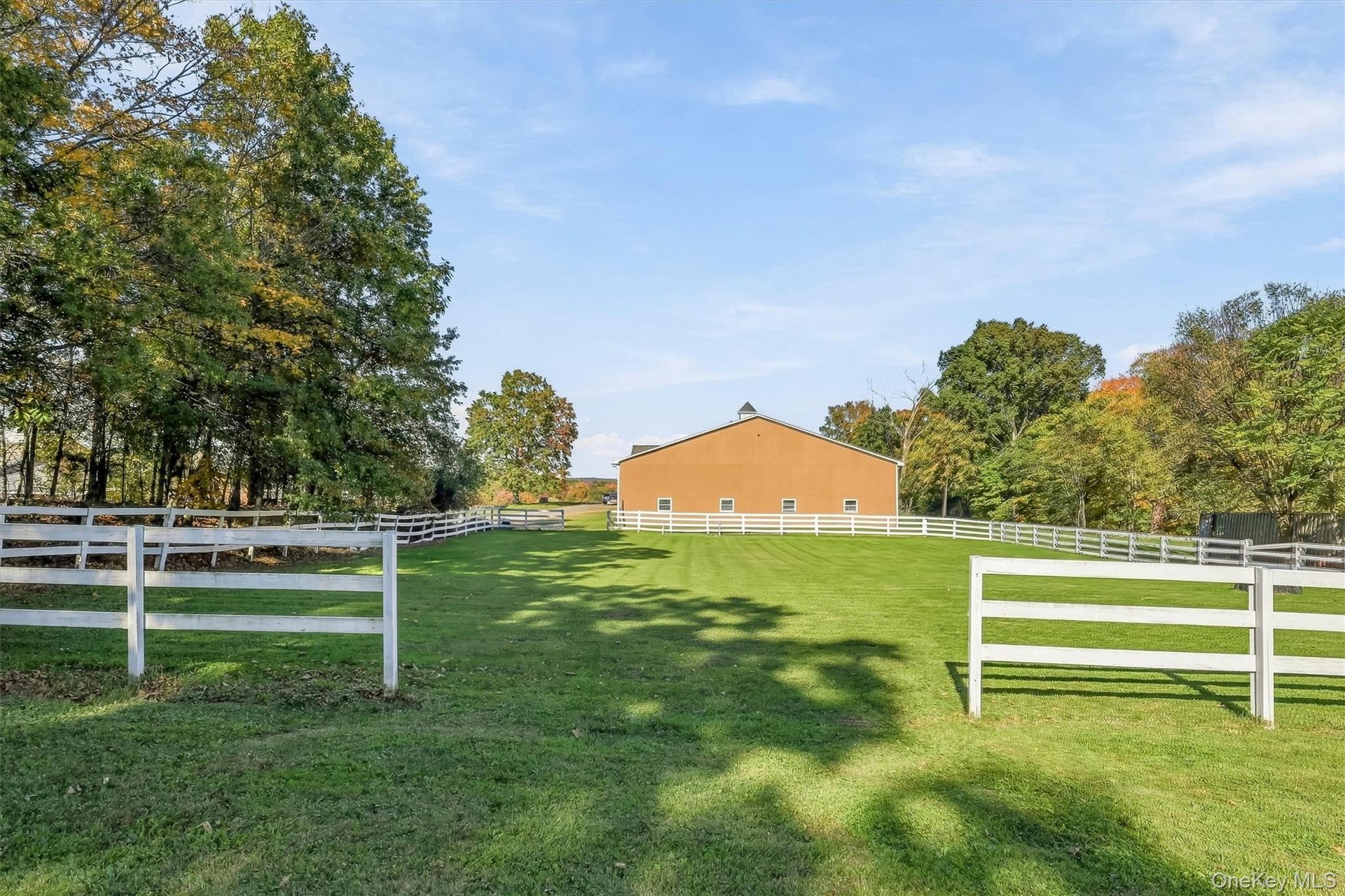 Main Barn – Side View with Grass Riding Arena