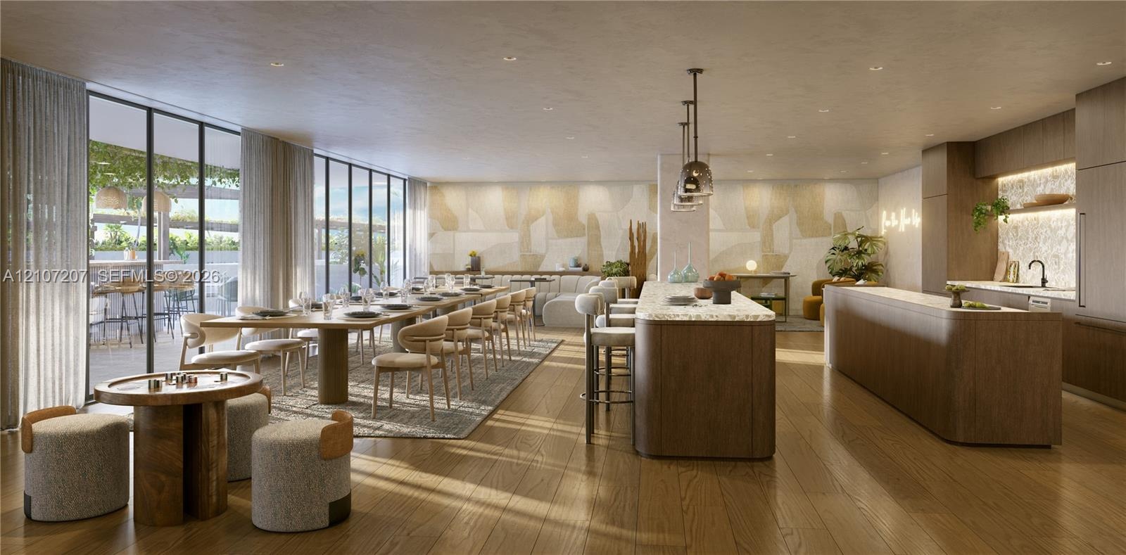Open-concept space featuring floor-to-ceiling windows, wood-finish flooring, two expansive kitchen islands with stone countertops, and recessed lighti