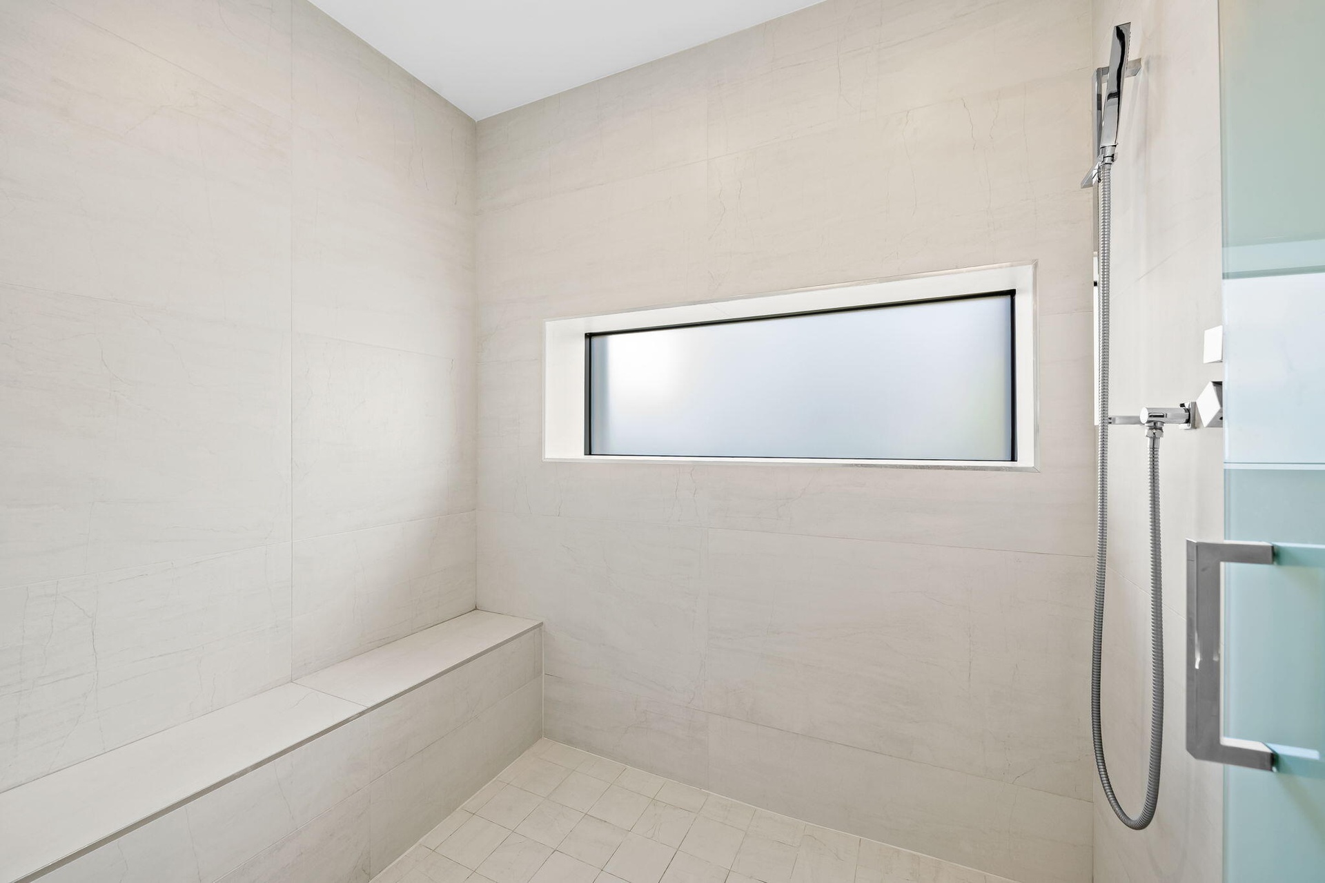 Primary bath shower bench + shampoo niche