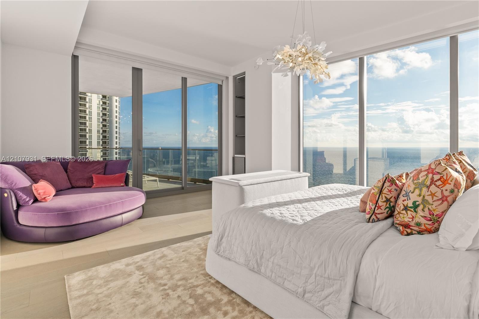Floor-to-ceiling glass windows, recessed display shelving, wood-finish flooring, integrated ceiling light fixture, and sliding glass doors opening to 
