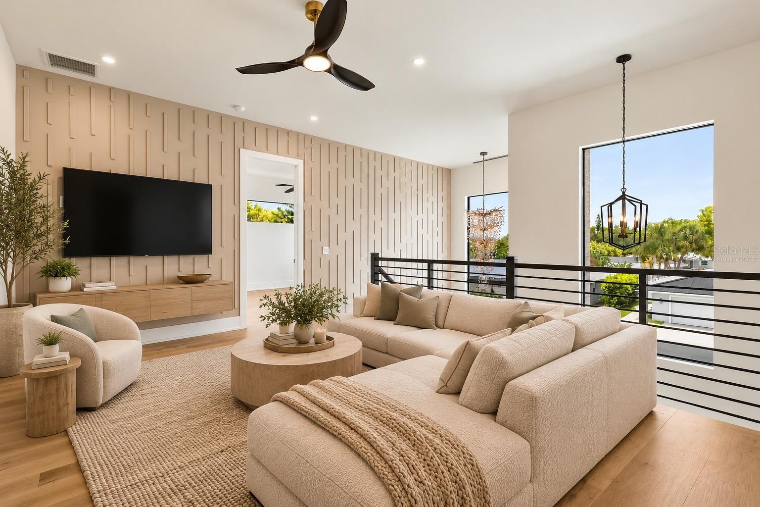 Virtually Staged, outside of primary bedroom upstairs can be used as a second seating area.