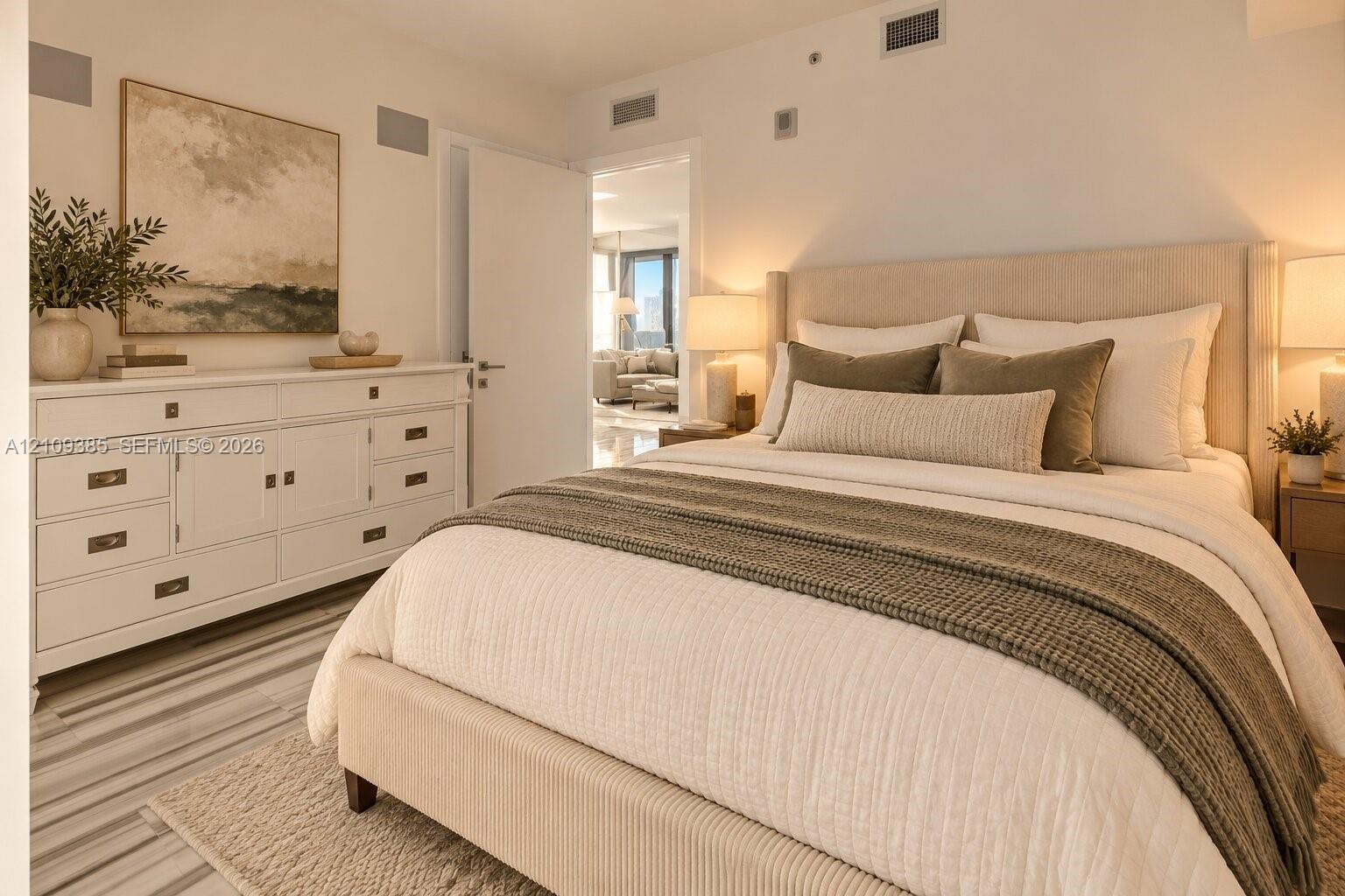 Neutral-toned interior featuring stone-finish flooring and recessed ceiling lighting