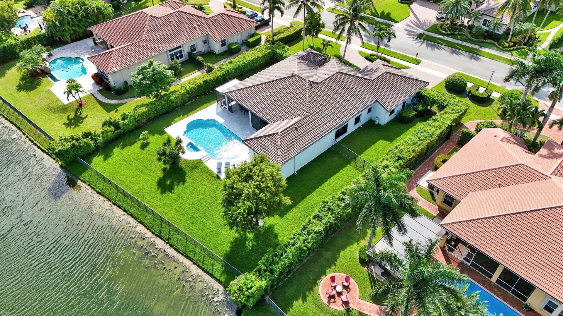 Fully fenced yard with privacy hedges