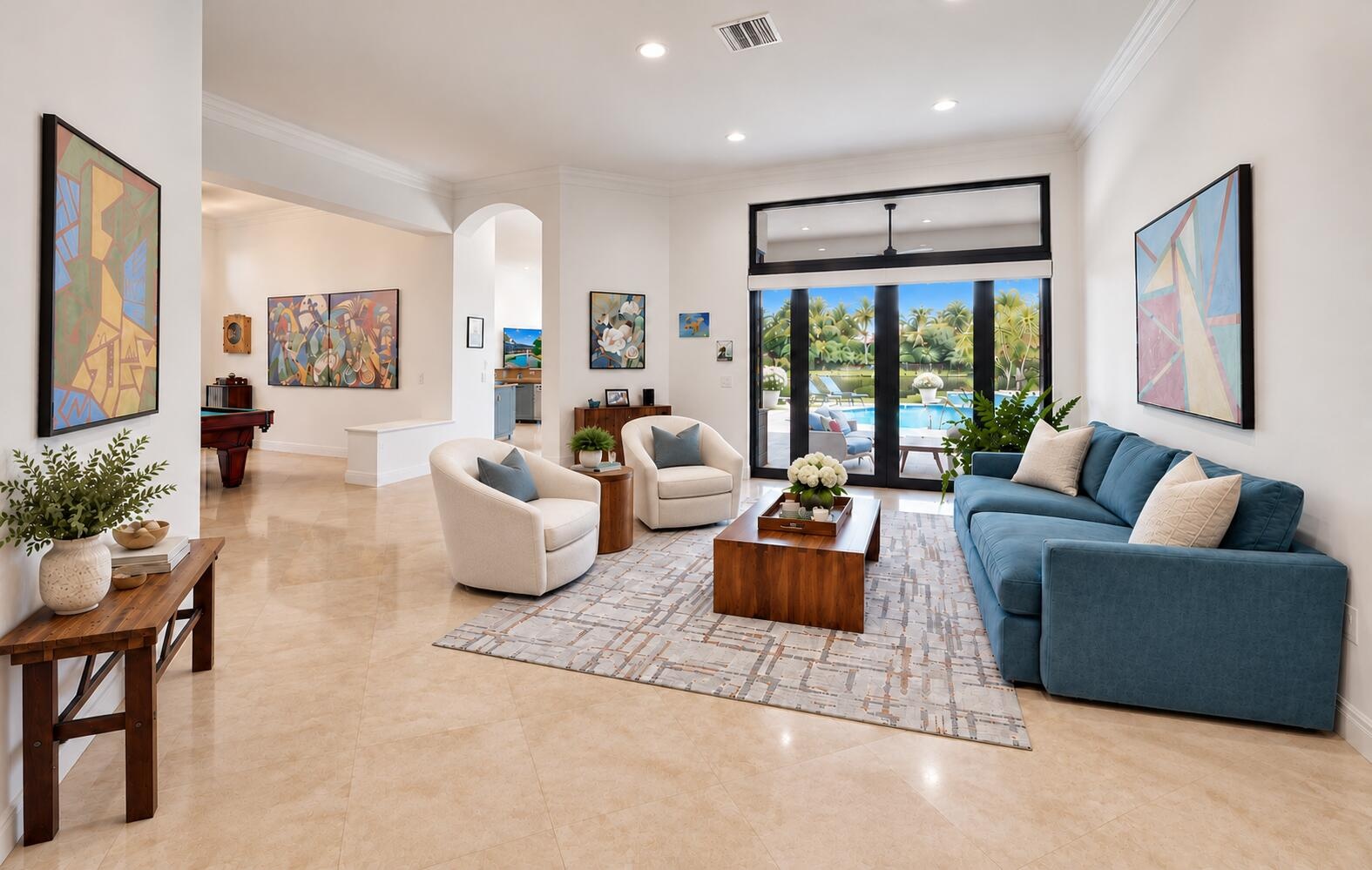 Living room with floor to ceiling impact sliding glass doors