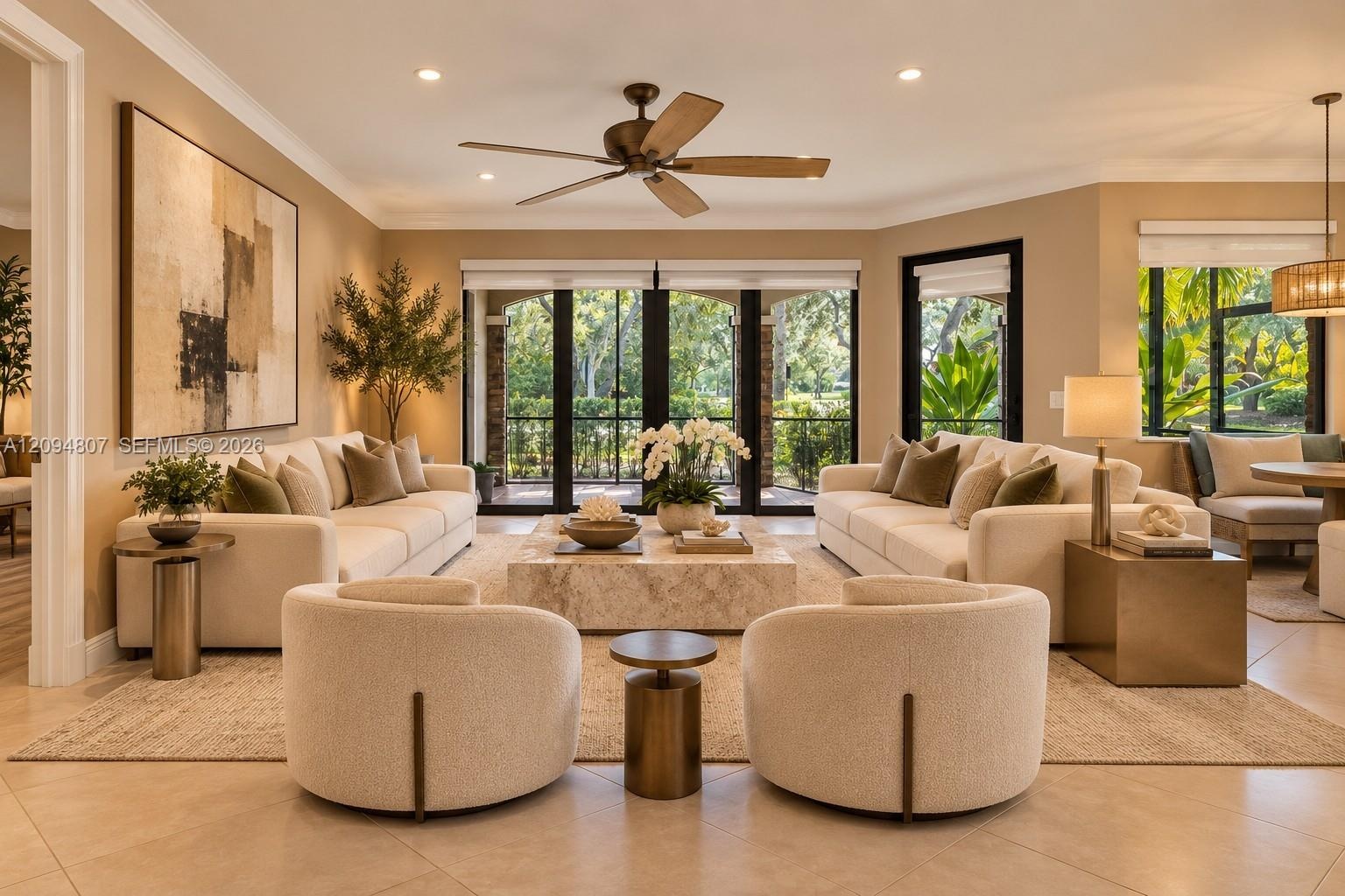 Living space featuring crown molding, neutral wall finishes, large-format tile flooring, a multi-blade ceiling fan, and floor-to-ceiling glass panel d