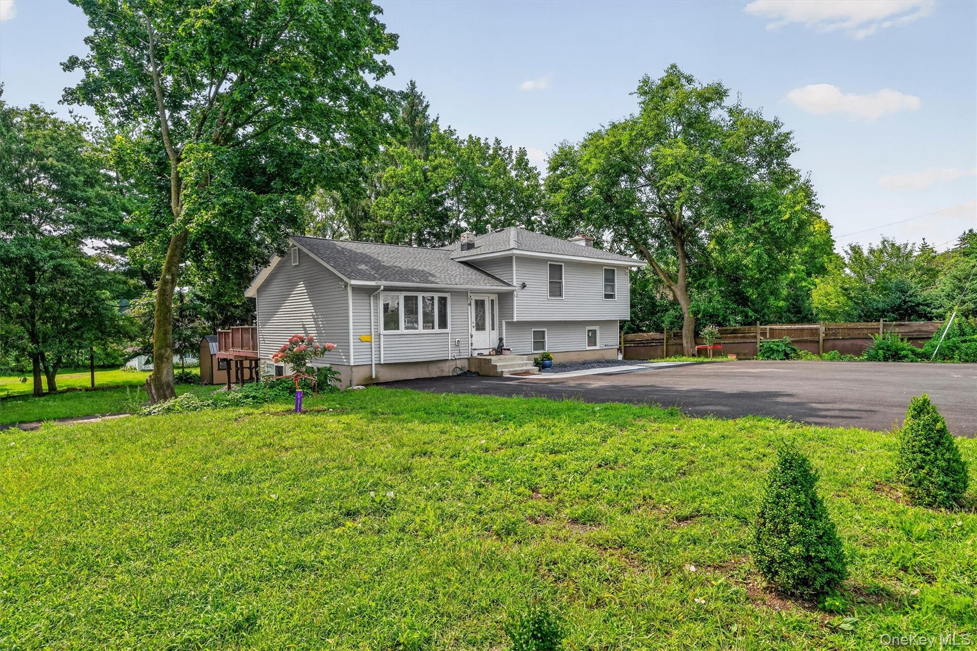 Large driveway accommodates several cars and offers a great space for play.