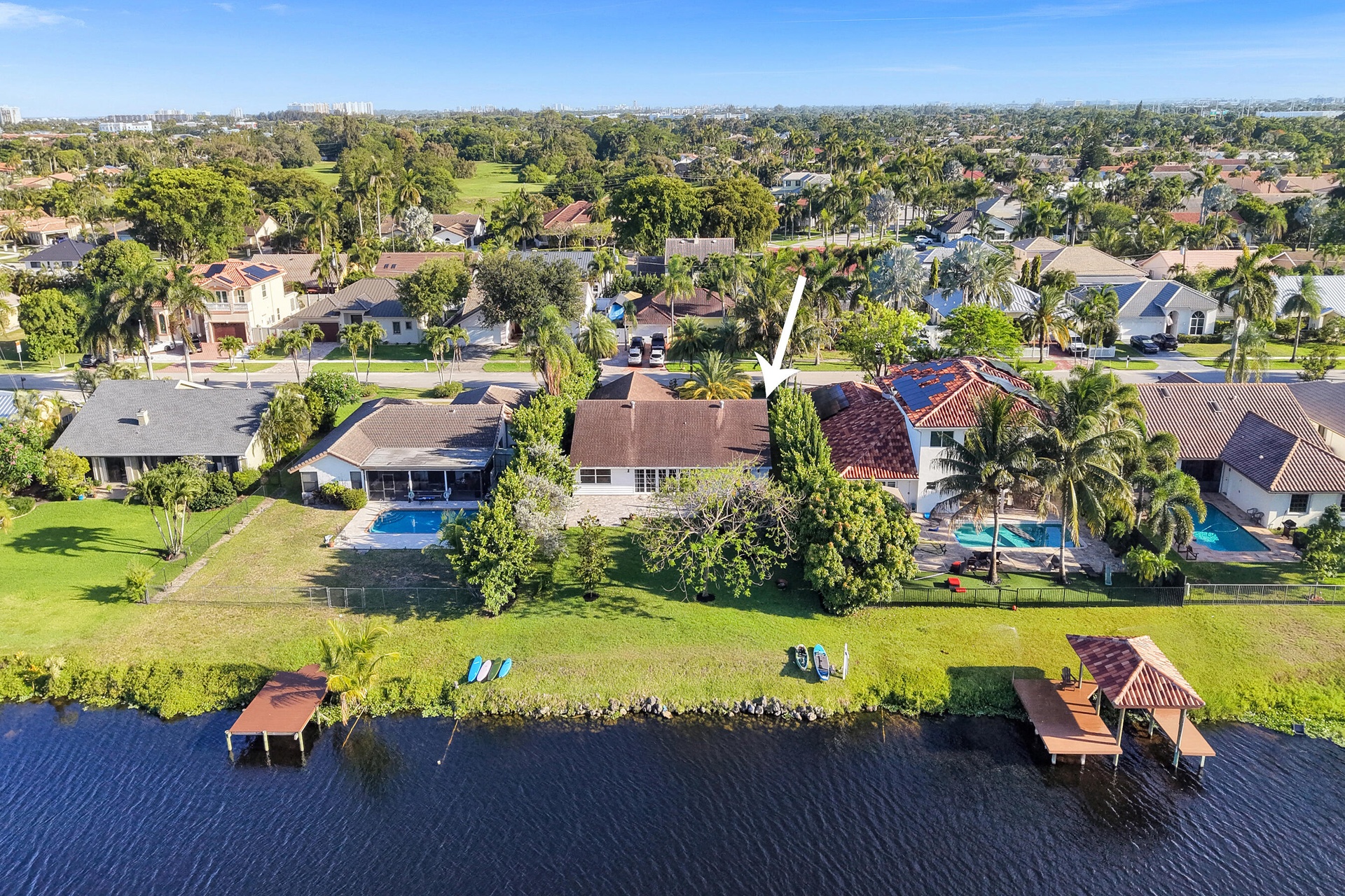 Home identified by the arrow. Pools and docks shown are on neighboring properties.