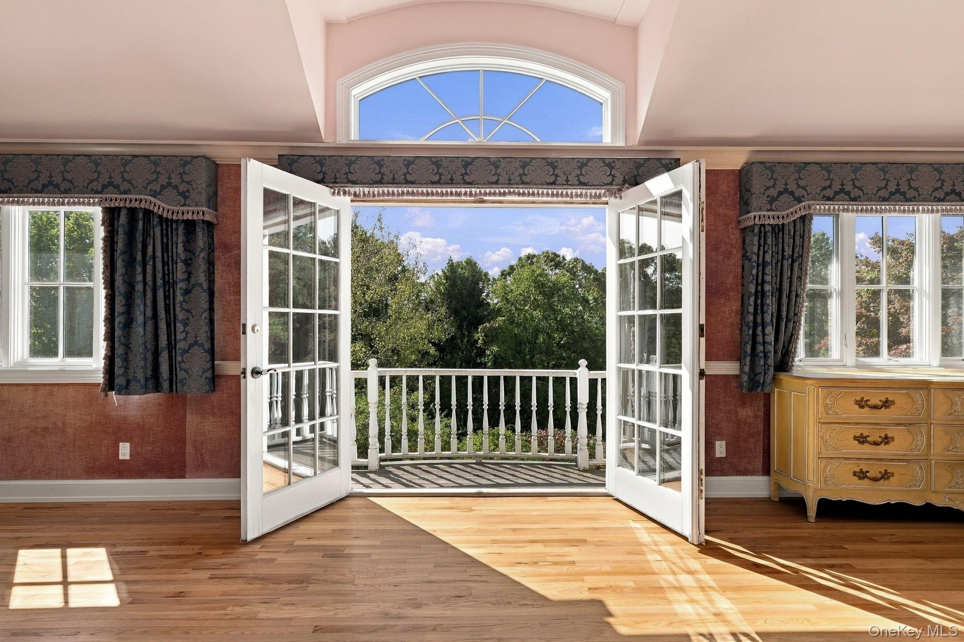 2nd Floor Primary Suite Balcony View down to the Gardens, Terrace & Conservatory Pool