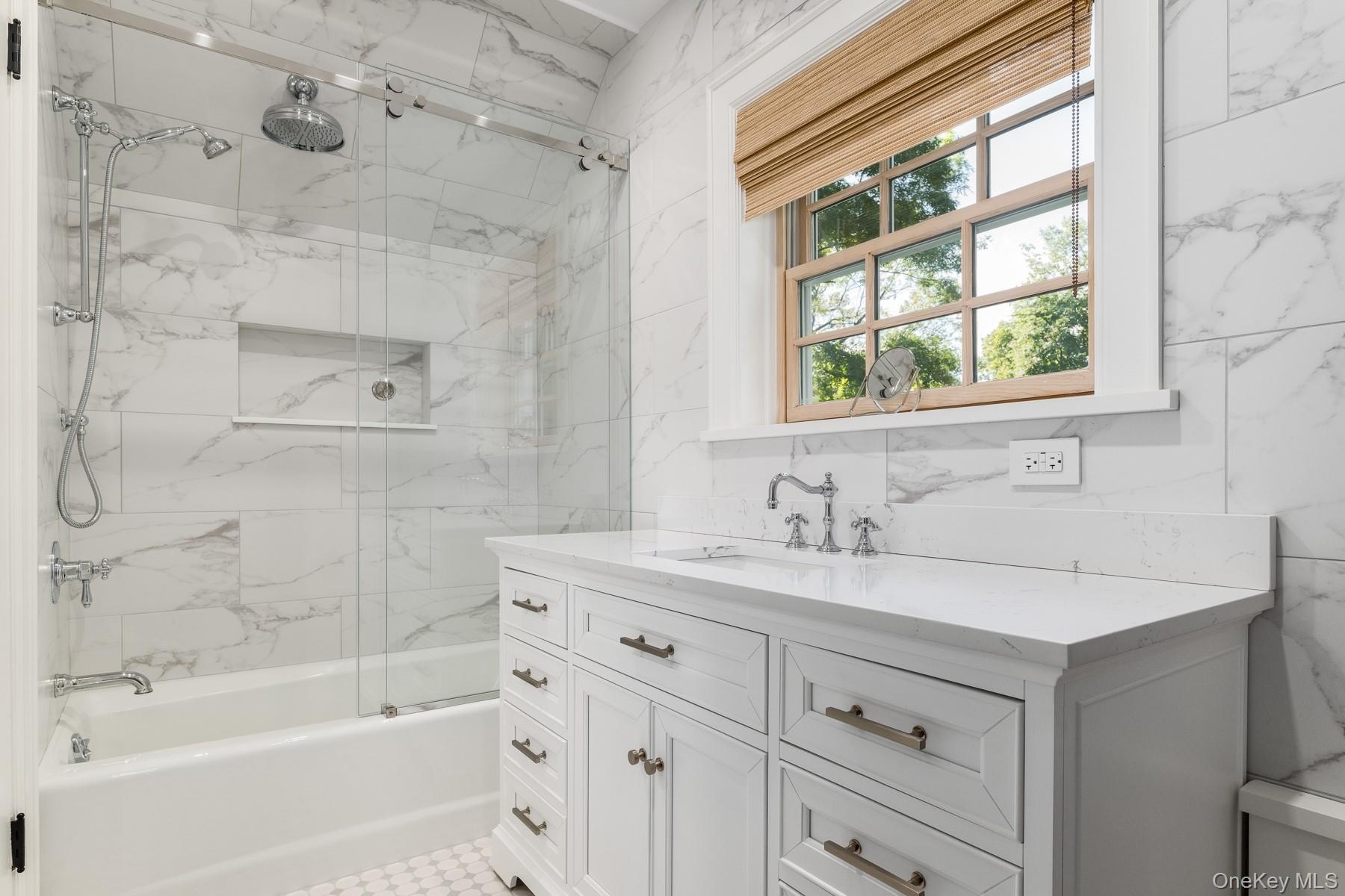 Fully renovated Jack-and-Jill Bathroom.