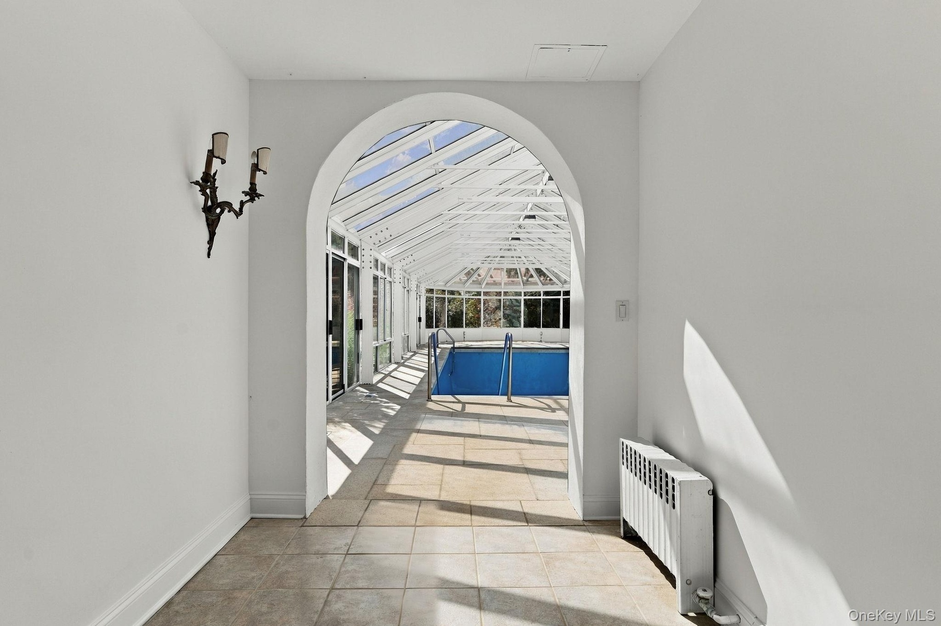 ..to the Conservatory Pool, Full Bath & Changing Room